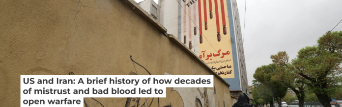 An Iranian walks past an anti-U.S. mural in Tehran on April 5, 2025. Atta Kenare/AFP via Getty Images